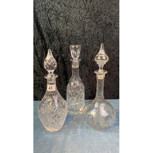 43 - Three cut glass decanters