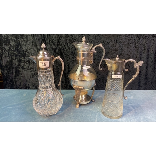 45 - Three glass and silver plate claret jugs