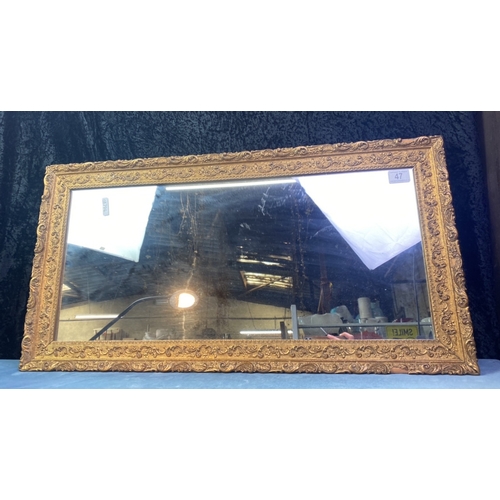 47 - Gilt framed rectangular mirror, approx 
40cm x 82cm