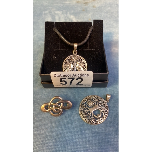 572 - 2 silver Celtic tree of life pendants and one other