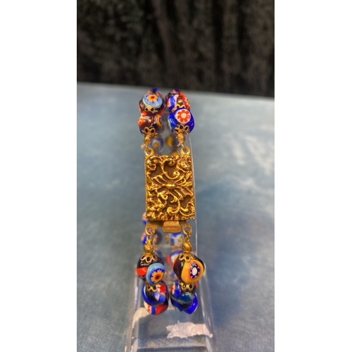 573 - Italian Millefiori multi coloured bead bracelet with gilt clasp