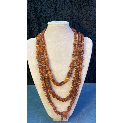 580 - 3 long raw amber bead necklaces