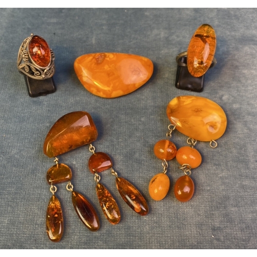 582 - 3 amber bead brooches and two amber rings