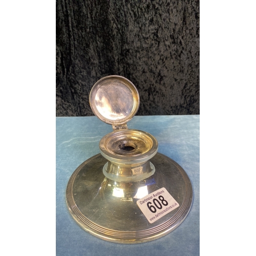 608 - Silver capstan inkwell with glass liner, base approx 14.5cm diameter, Birmingham 1909