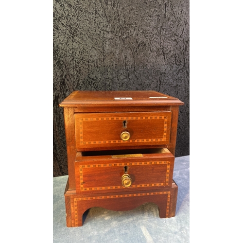 63 - Miniature chest of drawers with inlaid detail and brass knobs, approx 29.5cm tall