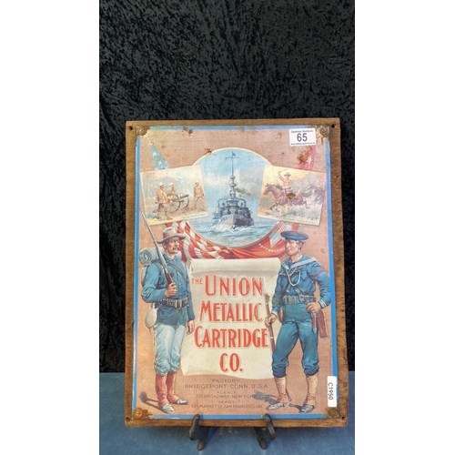 65 - Tin Union Metallic Cartridge Co sign mounted on a  wooden board