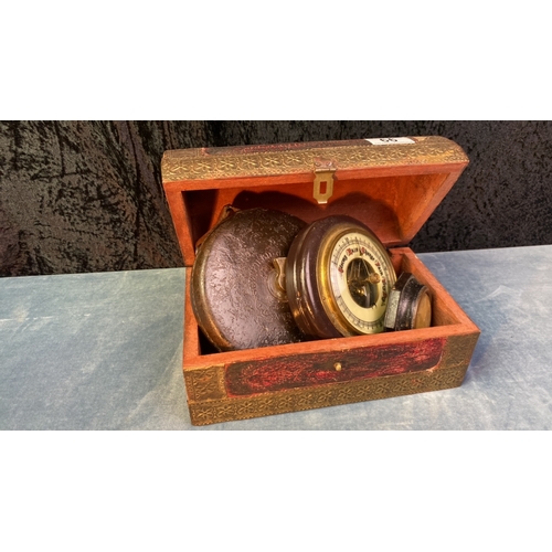 66 - Wooden treasure chest, vintage tape measure, barometer and circular thermometer