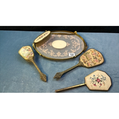 122 - Pretty vintage five piece dressing table set with hand stitched backs add bevelled glass