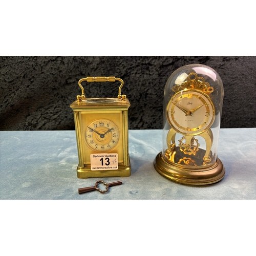 13 - Brass cased carriage clock with key, 11cm tall, (non-working) along with a Shaltz brass clock with p... 