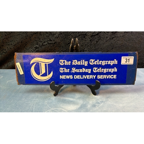 31 - Daily and Sunday Telegraph enamel sign, approx. 11cm x 40cm