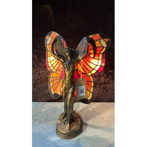 35 - Modern Tiffany style lamp by Widdop, Bingham & Co depicting a fairy with butterfly style wings, 40cm... 