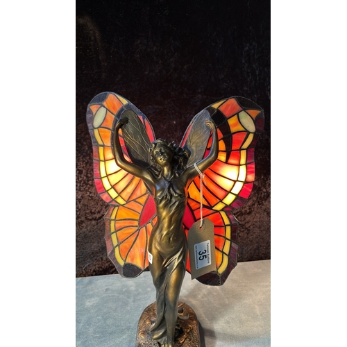 35 - Modern Tiffany style lamp by Widdop, Bingham & Co depicting a fairy with butterfly style wings, 40cm... 