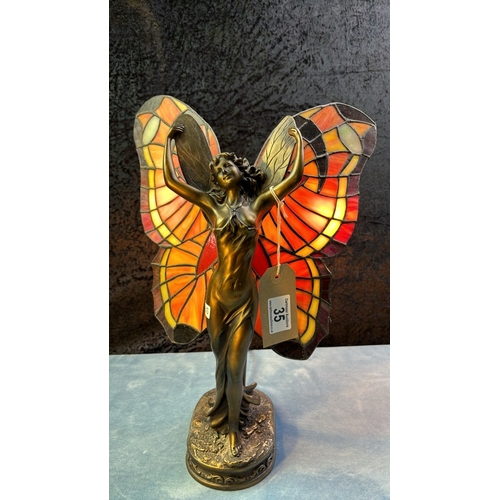 35 - Modern Tiffany style lamp by Widdop, Bingham & Co depicting a fairy with butterfly style wings, 40cm... 