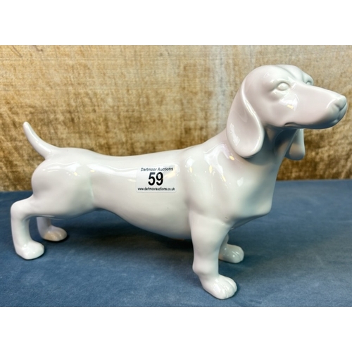 59 - Large ceramic Dachshund / Sausage dog figurine, approx. 20 cm tall and 28 cm nose to tail