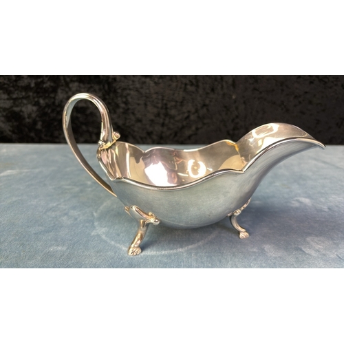 72 - Two silver plated sauce / gravy boats, one by Walker and Hall