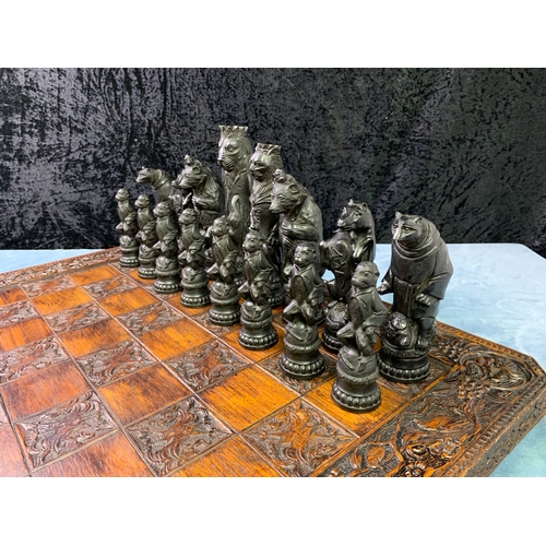 195 - A Grand Collector Reynard the Fox Chess Set with very decorative chess board 60x60cm. Black and Crea... 