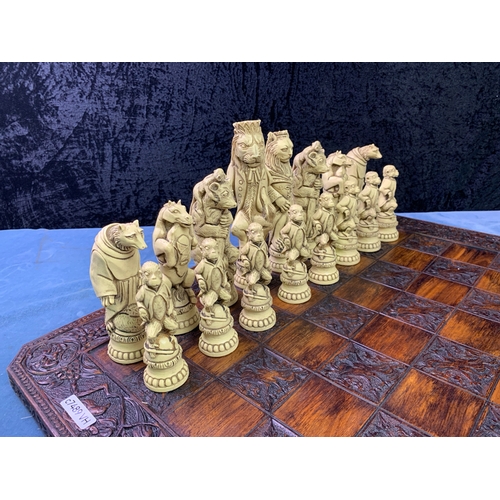 195 - A Grand Collector Reynard the Fox Chess Set with very decorative chess board 60x60cm. Black and Crea... 