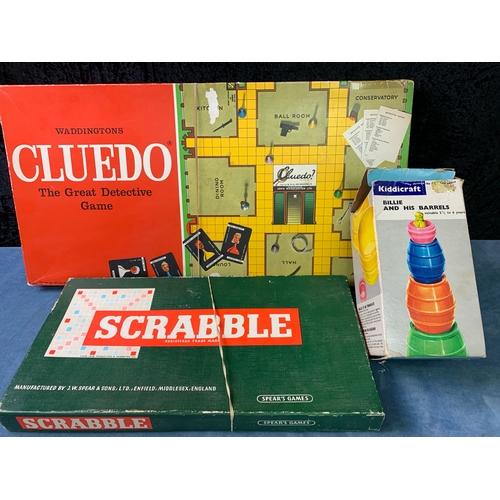 205 - A box full of vintage toys and games Inc plywood map puzzle, Scrabble, Bridge pads, Cluedo etc