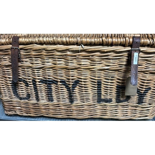 23 - Large sturdy wicker basket with leather straps marked CITY LDY, approx 39cm x 74cm x 53cm