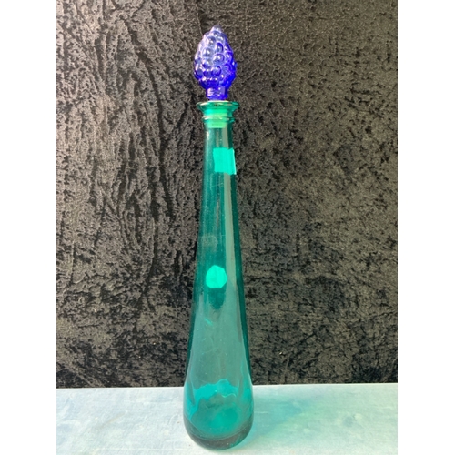 309 - Turquoise coloured glass bottles with grape design stoppers and a large glass fruit bowl