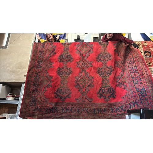 456 - Simply magnificent enormous woven rug in rich red colours and blue patterned detail. Measures approx... 