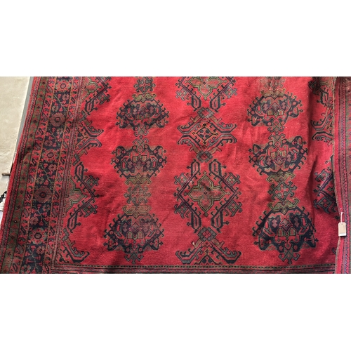 456 - Simply magnificent enormous woven rug in rich red colours and blue patterned detail. Measures approx... 