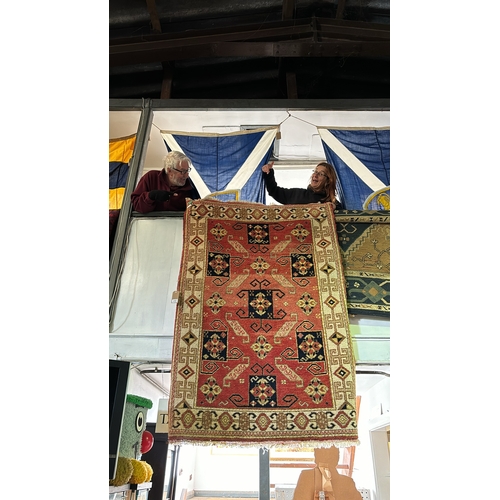 458 - Thick wool carpet rug with autumnal black, brown, orange and cream design, measures approx 286cm x 1... 