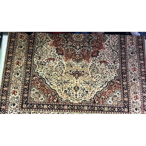 460 - Large floor rug in autumnal black, brown, fawn and orange  colours and a floral and animal design, m... 