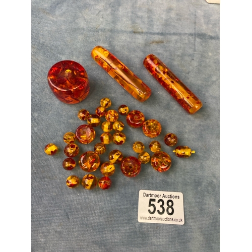 538 - An interesting collection of amber coloured beads of varying sizes