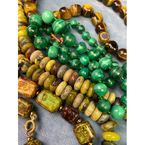 540 - A collection of vintage precious stone necklaces inc Tiger Eye, Malachite etc one a/f