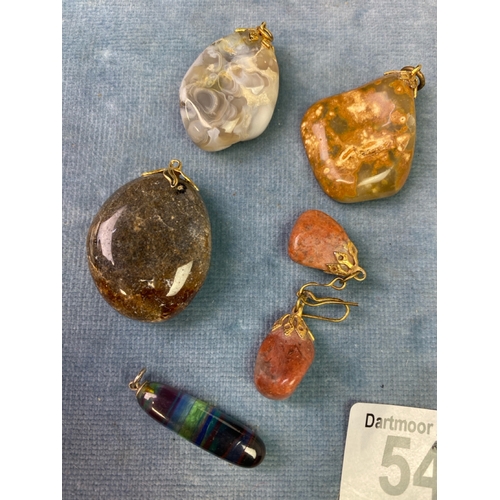 542 - A collection of gemstone pendants