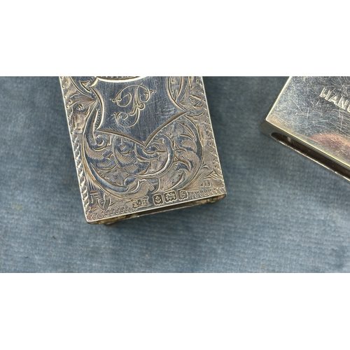 583 - Two silver matchbox covers