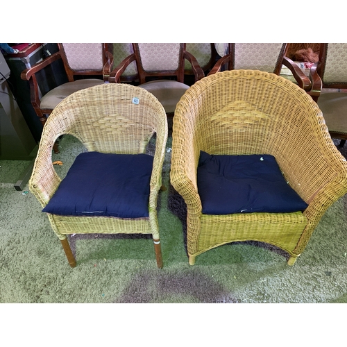 622 - Two wicker tub chairs, one large & one slightly smaller.