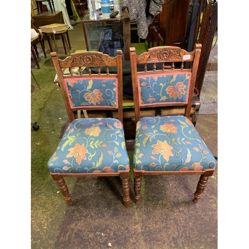 623 - Matching pair of sprung seated and upholstered dining chairs.  Some signs of historic worm damage to... 