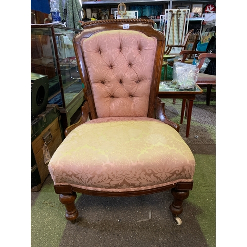 625 - Antique walnut and upholstered bedroom chair with turned legs and original ceramic casters.