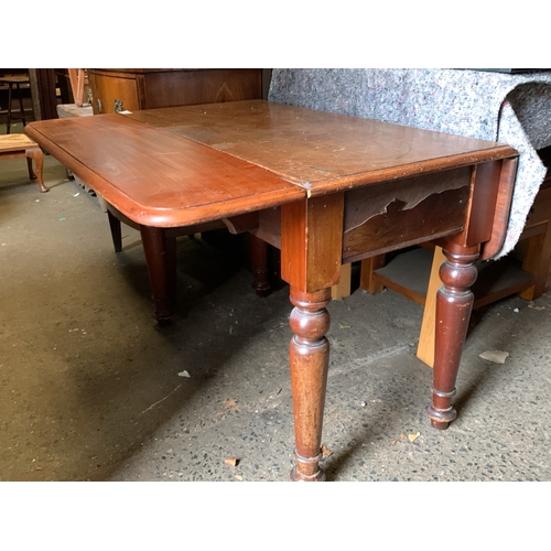 636 - Small mahogany drop leaf table with end drawer.  H75cm x W48cm extending to 90cm x D90cm