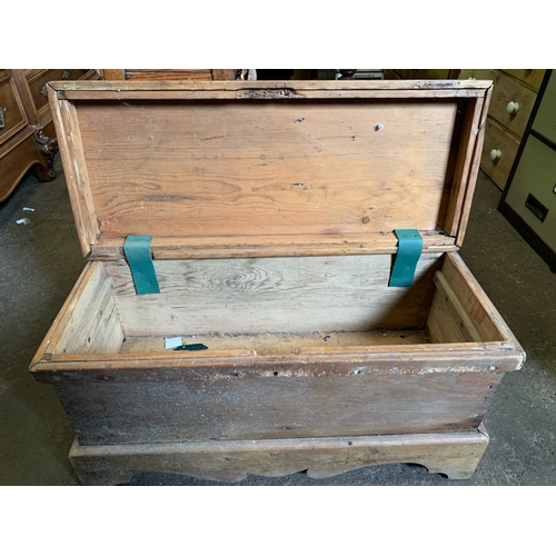 638 - Small antique pine storage trunk.  Lid hinges have been replaced with straps.  H45cm x W82cm x D35cm