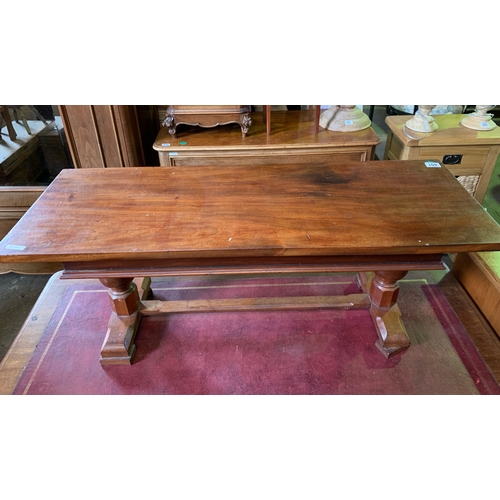 651 - Solid mahogany coffee table on decorative base.  H41cm x W97cm