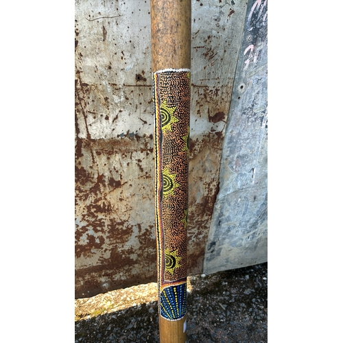 69 - Didgeridoo with hand painted detail, approx. 130cm long