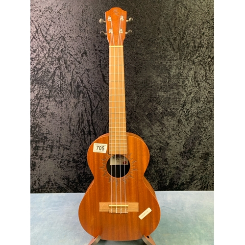 705 - A brand new Baton Rouge plain wood ukulele with sunburst design. Comes complete with matching wooden... 