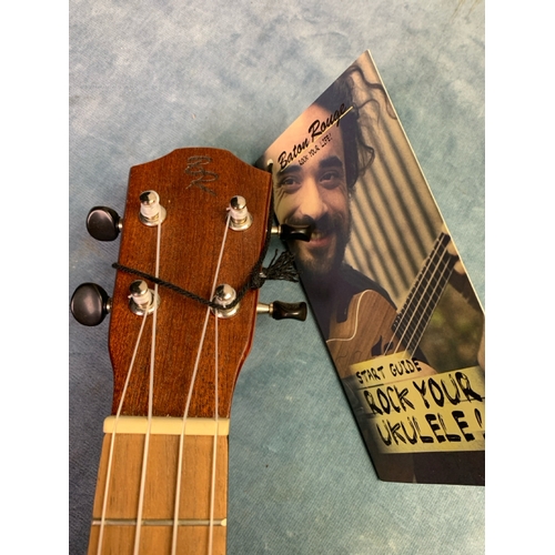 706 - A second brand new Baton Rouge plain wood ukulele with sunburst design. Comes complete with matching... 