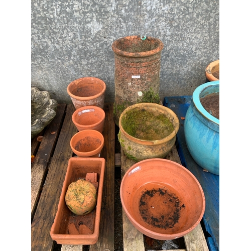 731 - 8 items of garden pottery Inc an antique chimney and a small herb pot