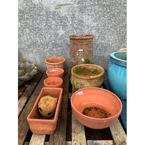 731 - 8 items of garden pottery Inc an antique chimney and a small herb pot