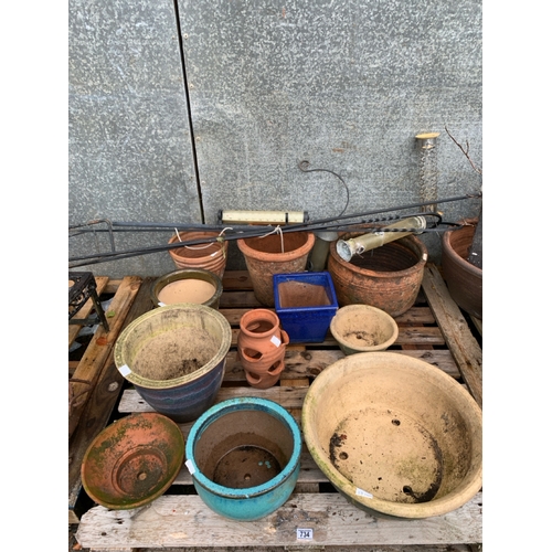 734 - A pallet of garden pots of varying descriptions inc a strawberry/herb planter and bulb pots