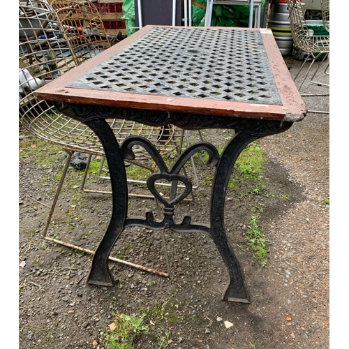 741 - Iron based outdoor table with criss cross metal worktop H64cm x L119