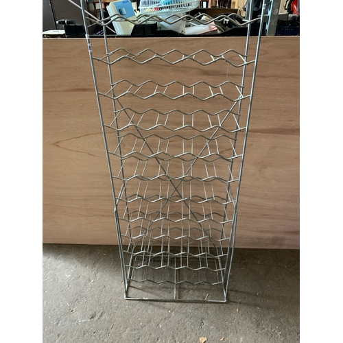 886 - A freestanding metal wine rack H137cm