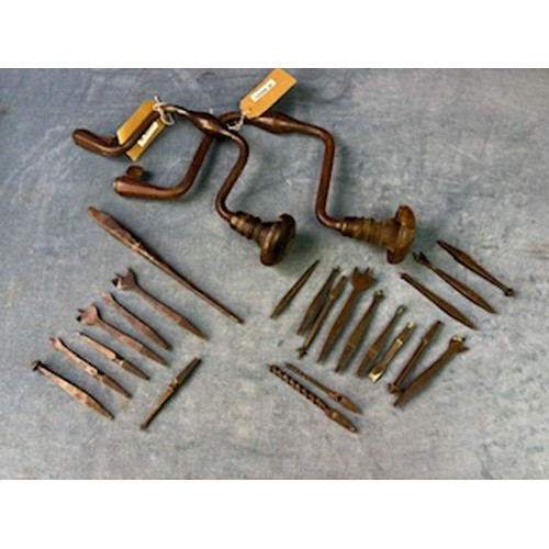 877 - A brace of 18th century Iron braces, with a rare collection of bits