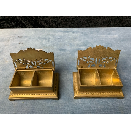 18 - Brass desk set with two glass inkwells, a brass sword letter opener and two brass stamp holders