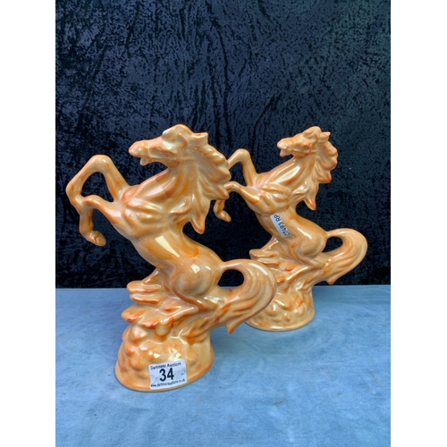 34 - Pair of ceramic rearing horse figures, approx 26cm tall