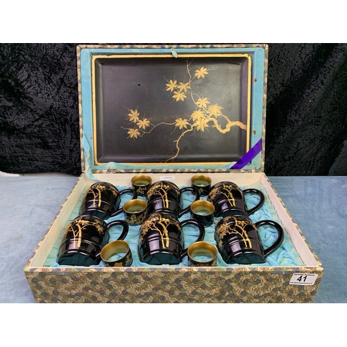 41 - Oriental / Japanese boxed set of lacquerware drinks tankards with tray and napkin rings, all beautif... 